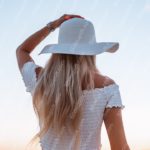 White Hat Woman Sunset Background Image & Google Slides Theme